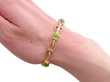 Art Nouveau Peridot Bracelet in Gold being worn