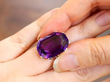 Antique Amethyst Cocktail Ring in Platinum on hand