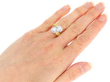 Twist Pear Cut Cluster Engagement Ring in Gold on hand