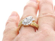 Twist Pear Cut Cluster Engagement Ring in Gold on finger