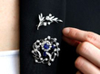 wearing gemstone brooches