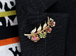 wearing Floral Cartier Brooch in Gold