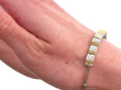 White and Yellow Gold Diamond Line Bracelet on wrist
