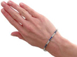 wearing Sapphire and Diamond Tennis Bracelet in Platinum