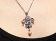 wearing Pearl Diamond and Emerald Pendant