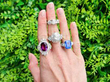 gemstone rings on hand