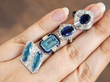 blue gemstone rings on hand
