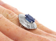 3ct Oval Sapphire Ballerina Ring in Platinum on hand