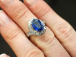 Sapphire and Diamond Halo Bypass Ring on finger