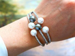 wearing Large Pearl and Diamond Bangle in White Gold