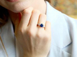 Platinum Sapphire Ring with Pear Side Diamonds wearing