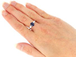 wearing Platinum Sapphire Ring with Pear Side Diamonds