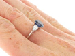 Platinum Sapphire Ring with Pear Side Diamonds on hand