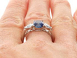 Sapphire Ring with Pear Side Diamonds on finger