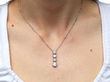 wearing Diamond Drop Pendant Necklace in Platinum
