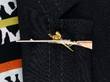 Vintage Pheasant and Shotgun Brooch being worn