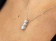 three stone diamond platinum pendant wearing