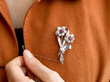 floral ruby brooch wearing