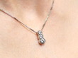 wearing Three Stone Platinum Pendant