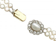 Double strand pearl necklace with clasp open
