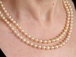 Double strand pearl necklace with clasp on neck