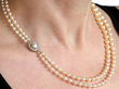Double strand pearl necklace with clasp on neck