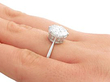 platinum solitaire engagement ring on hand 