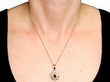 wearing emerald pendant