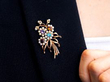wearing an antique gemstone brooch
