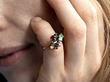 posing with a multi genmstone ring