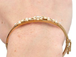 pearl bangle on wrist