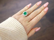 emerald and diamond yellow gold ring wearing