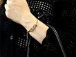 wearing a gold diamond bangle