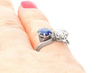 Blue Sapphire and Diamond Twist Ring Wearing on finger