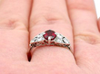 wearing garnet and diamond ring in platinum