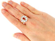 ruby and diamond cluster ring on hand