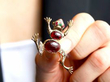 wearing gold garnet frog brooch