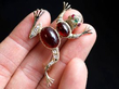 holding gold garnet frog