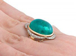 Cabochon Cut Gold Emerald Ring on hand