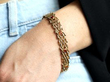 citrine and gold gate bracelet on wrist