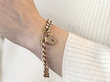 gold padlock bracelet on wrist