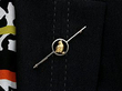 wearing gold chick brooch