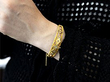 gold opal bangle on arm