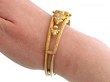 gold opal bangle on wrist