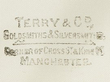 Silver Trowel and Mallet  Retailer's mark