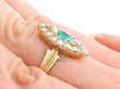 Wearing Emerald and Diamond Ring on hand