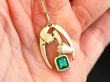 Holding Emerald Pendant
