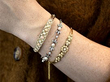 stacked antique pearl bracelet on wrist