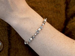wearing antique pearl bracelet on wrist
