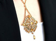 wearing a large gold citrine pendant